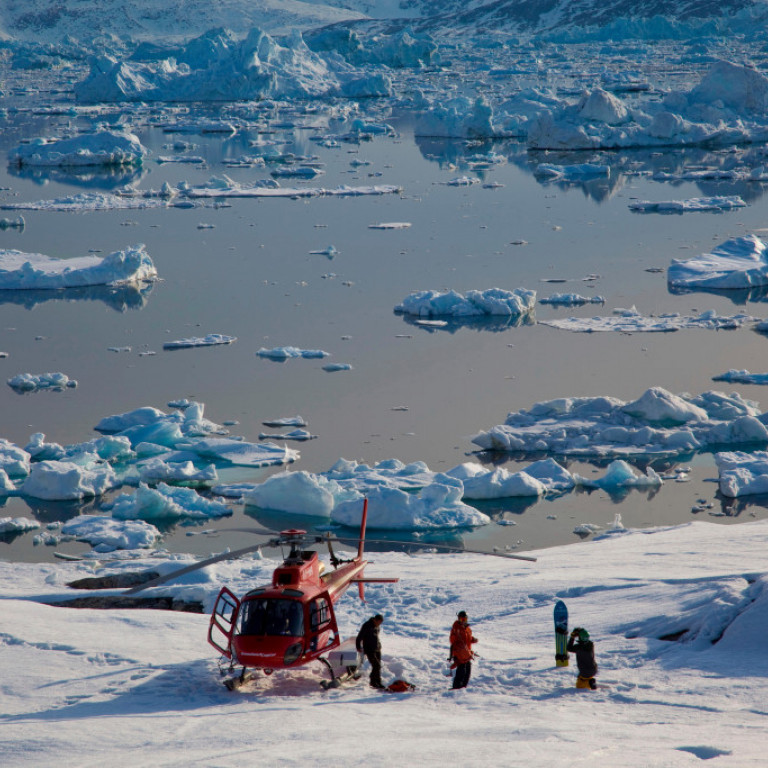 Skiing down to sea level where icebergs are floating on the fjords of East Greenland and taking a brake t soak in the spectacular natural wonders.