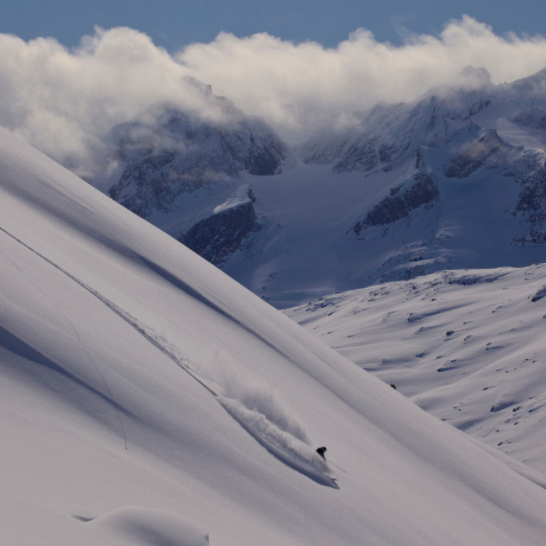 Powder heliskiing in Greenland amidst giant peaks and glaciers that make p one of the worlds most unique heli skiing destinations.