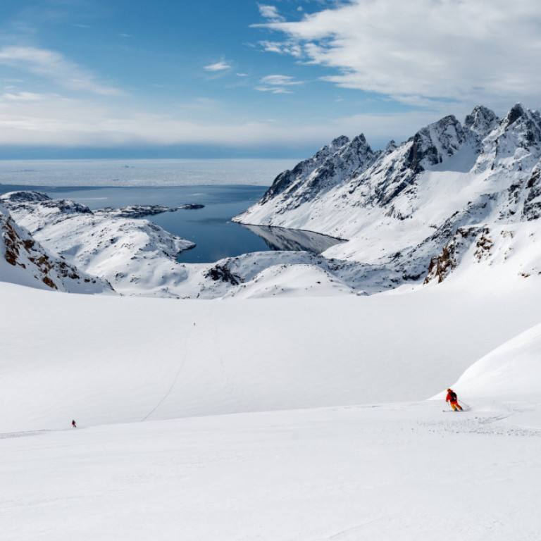 Heli-skiing down one of the many glaciers on Ammassalik island on the east coast of Greenland. Perfect snow and terrain made for heliskiing and boarding.  ©Eli Spiegel
