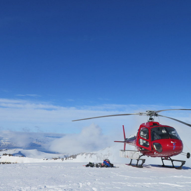 Helicopter resting on a mountaintop
