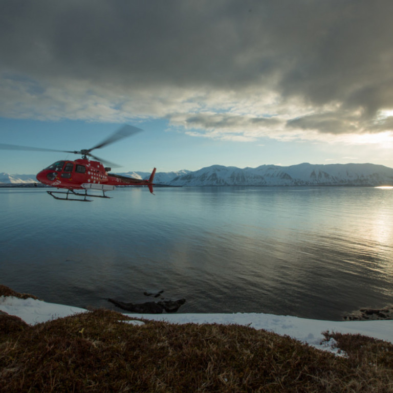 Helicopter flying in the Icelandic summer night