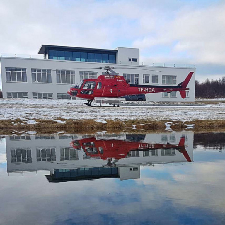 Air Greenland helicopter in front of Hotel Hjalteyri