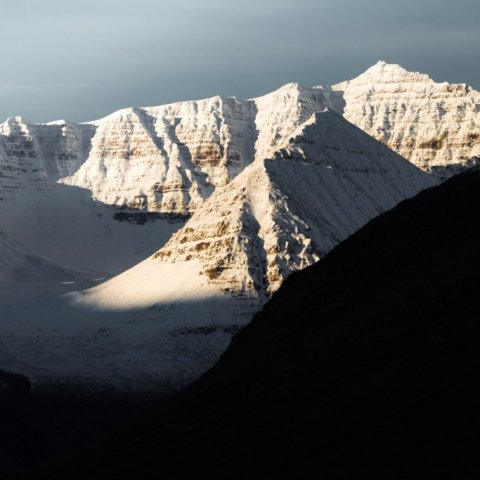 Snow-clad peaks rising above Skíðadalur 