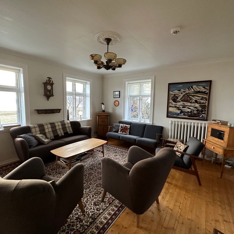 Living room area main level with unobstructed views of the fjörd out the windows