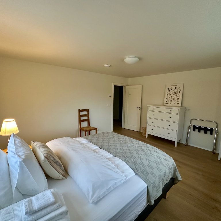 One of 3 bedrooms on lower floor of main house with a shared bathroom. Intended for guests requiring single room.