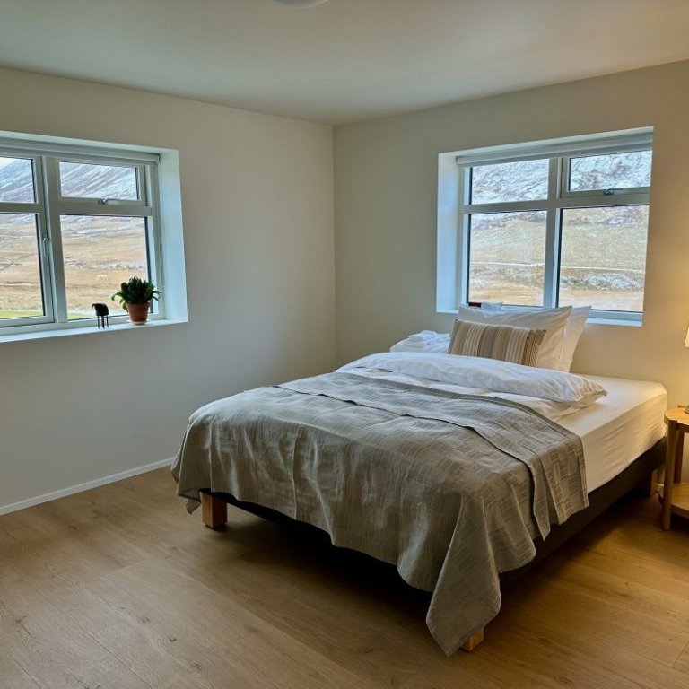 One of 3 bedrooms on lower floor of main house with a shared bathroom. Intended for guests requiring single room.
