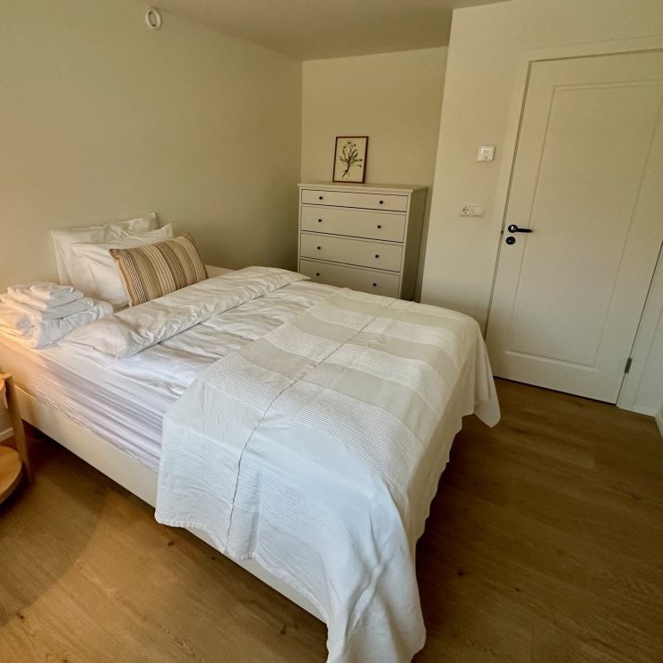 One of 3 bedrooms on lower floor of main house with a shared bathroom. Intended for guests requiring single room.