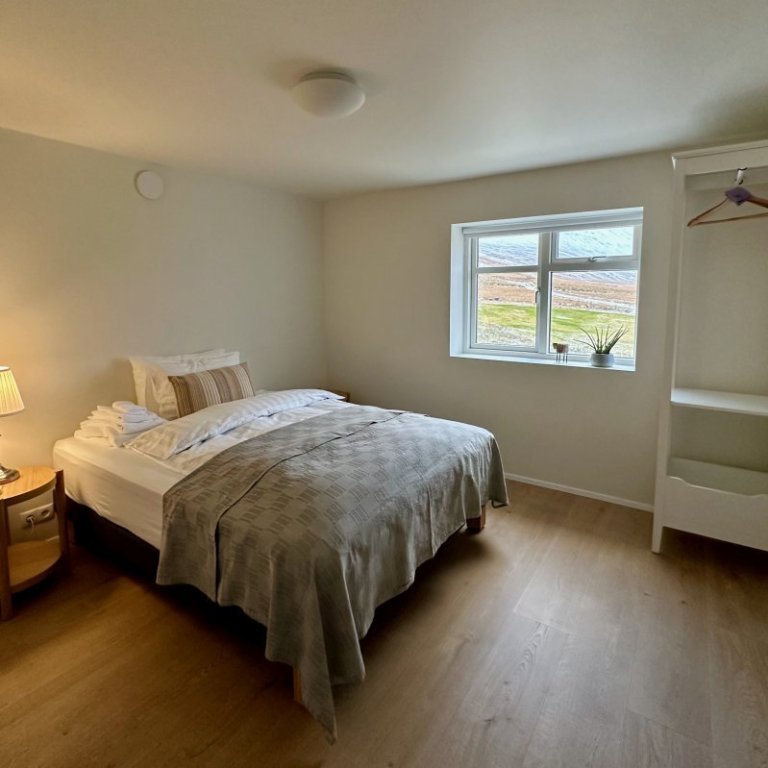 One of 3 bedrooms on lower floor of main house with a shared bathroom. Intended for guests requiring single room.