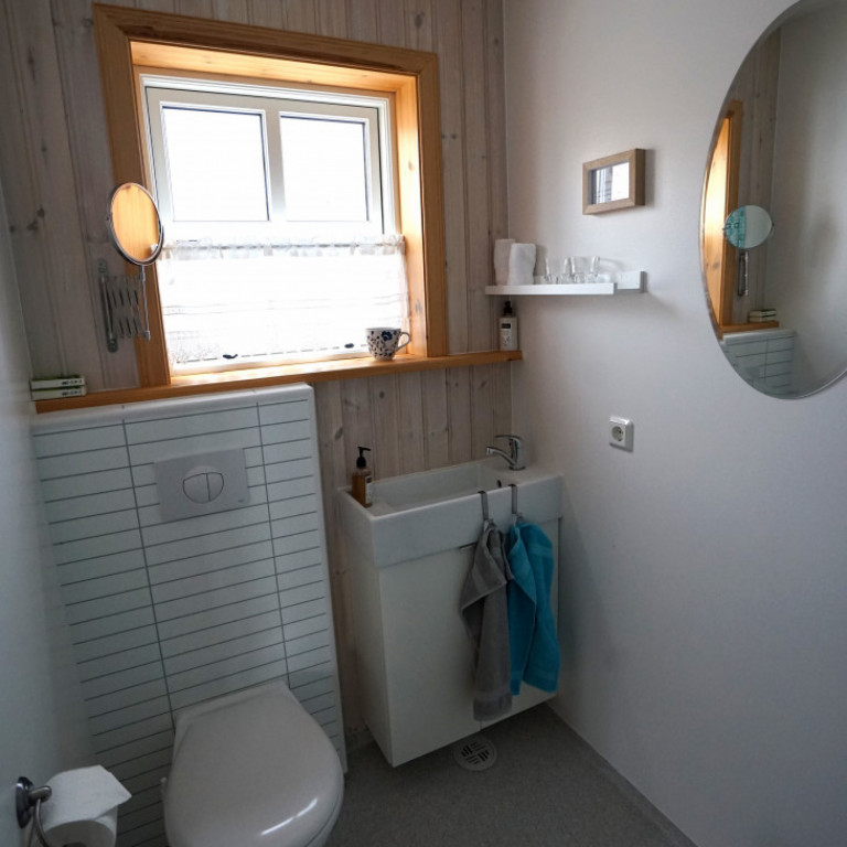 Bathroom in apartment. 2 apartments per cabin, each apartment has 1 bathroom.