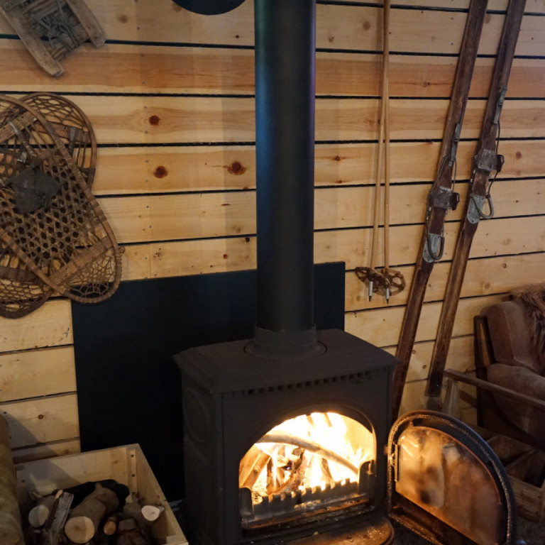 Woodburning stove in the lounge area of the barn