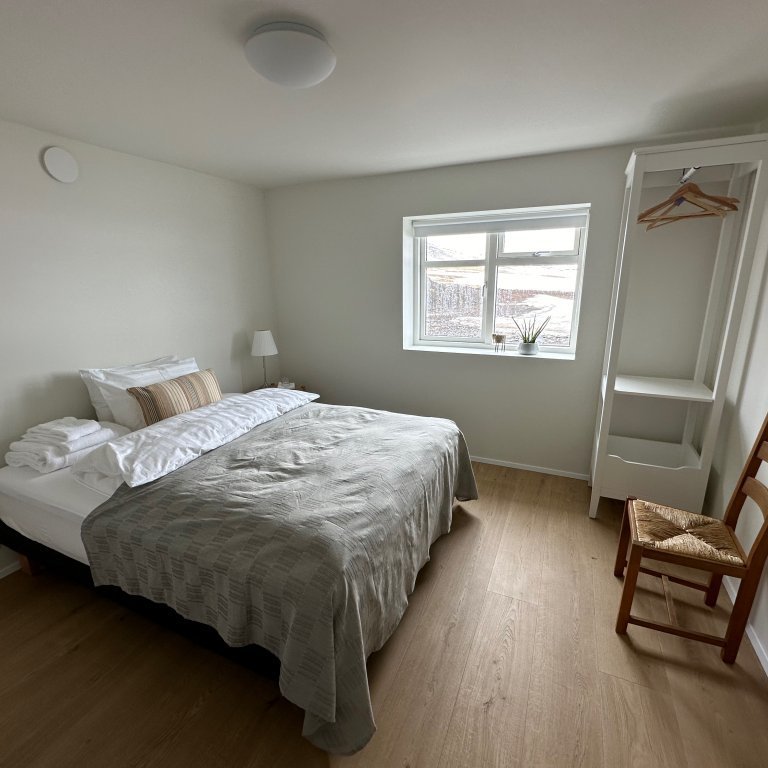 Single room in main house with shared bathroom.