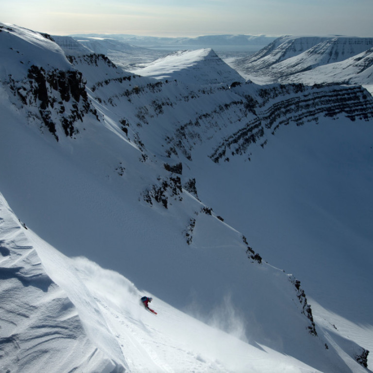 Skier Jess McMillan droping into one of the many bowls of the Troll Peninsula ©Richard Walch