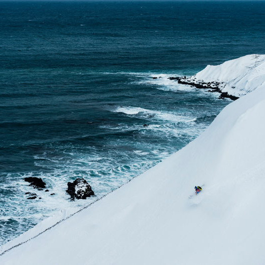 Andreas Fransson skiing powder next the ocean on Troll Peninsula, Iceland ©Mattias Fredriksson