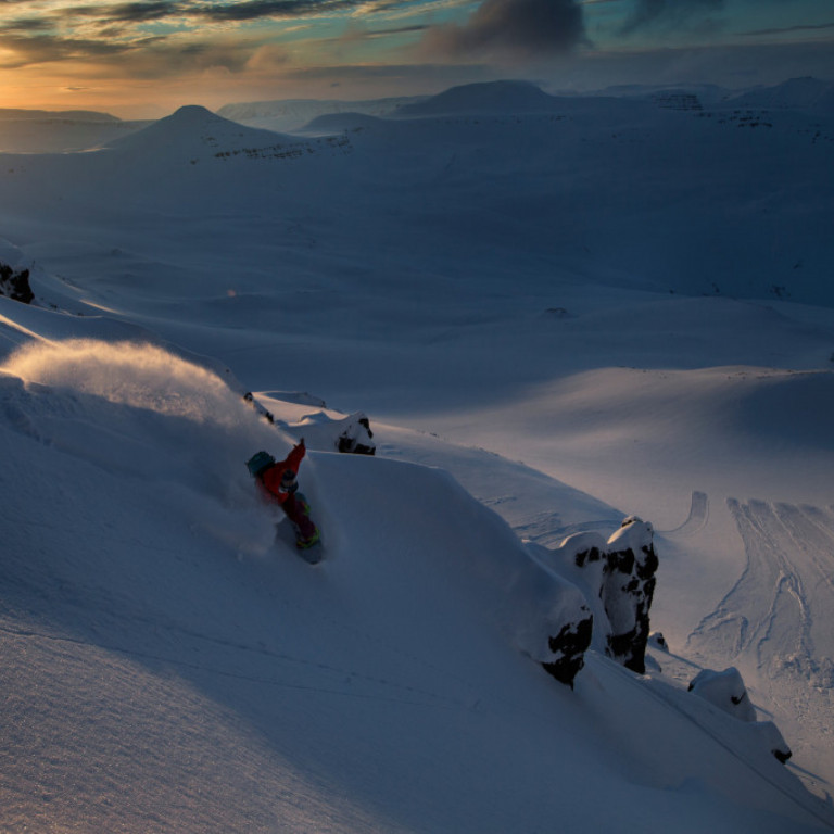 Snowboarding getting one last run before the sun sets ©Richard Walch